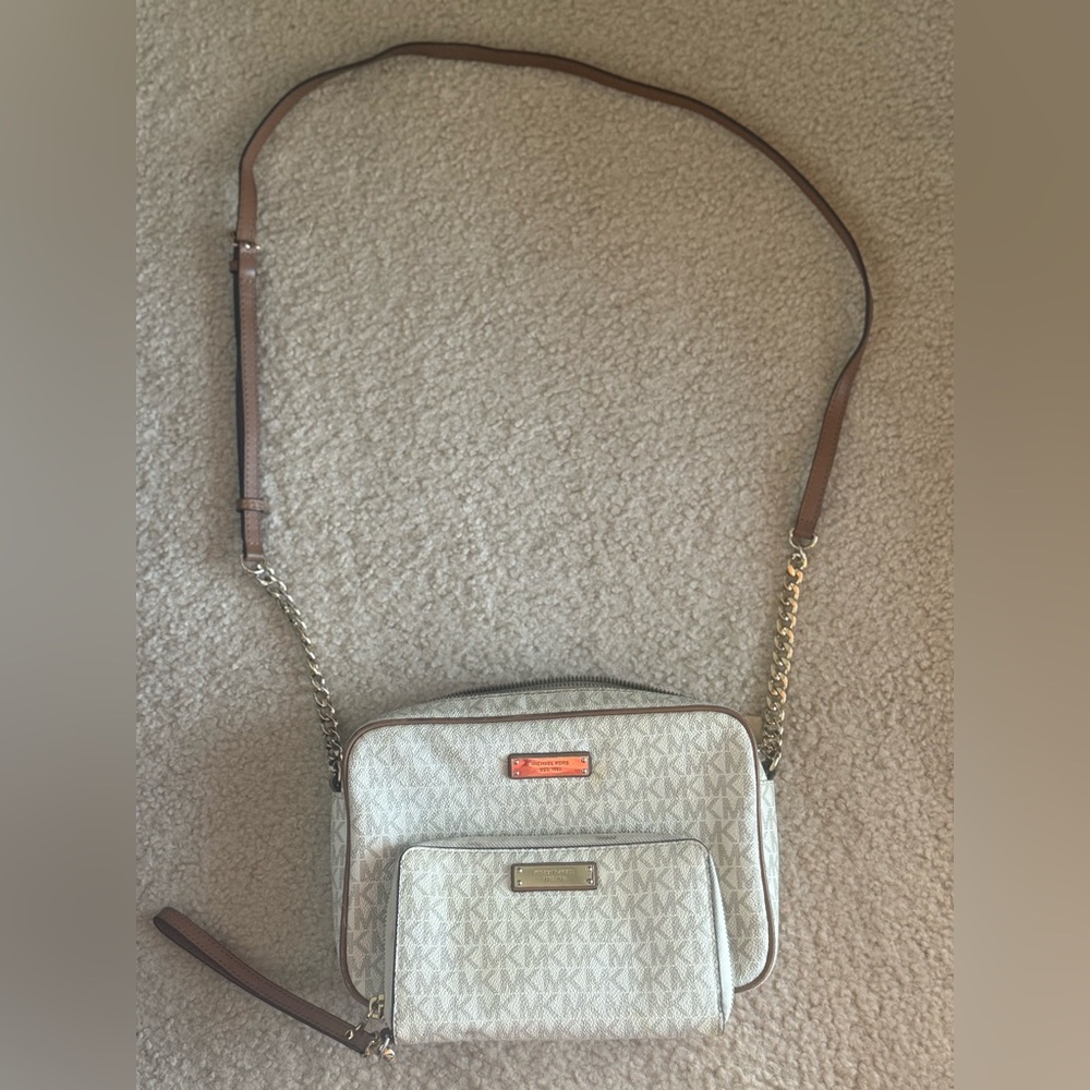 Michale Kors crossbody purse and matching wallet.